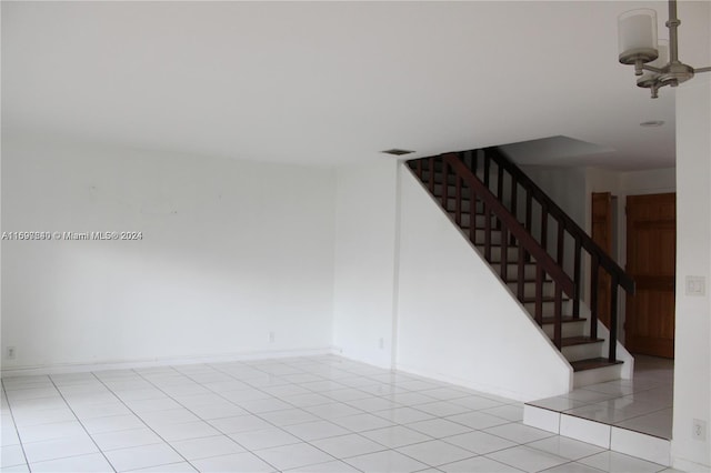 unfurnished room featuring light tile patterned floors