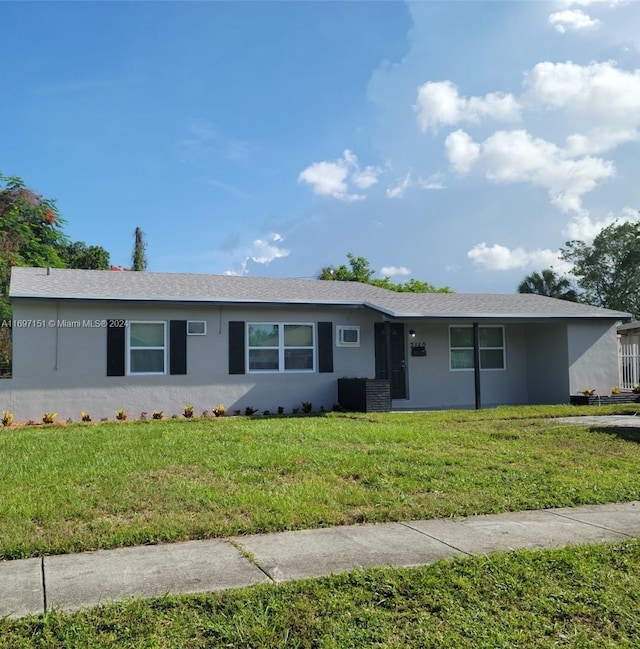 single story home featuring a front yard