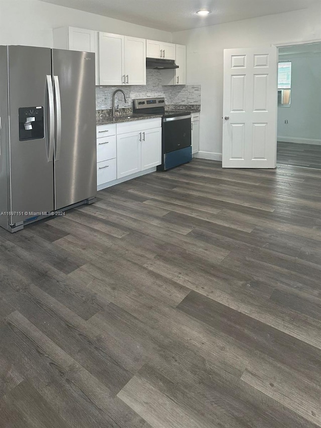 kitchen featuring white cabinets, dark hardwood / wood-style floors, decorative backsplash, and appliances with stainless steel finishes