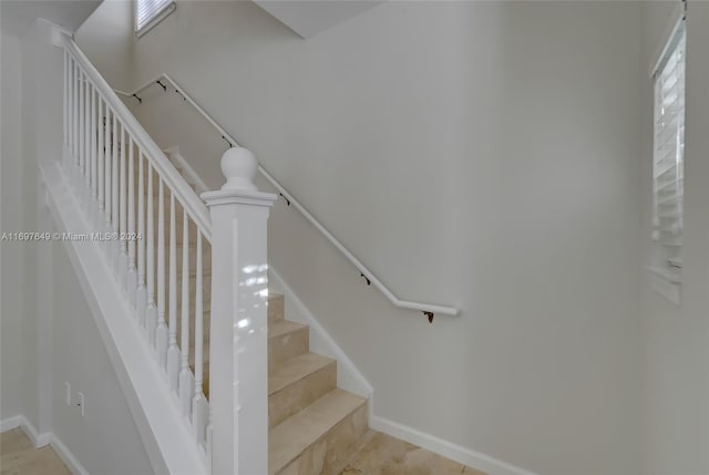 stairs featuring tile patterned flooring