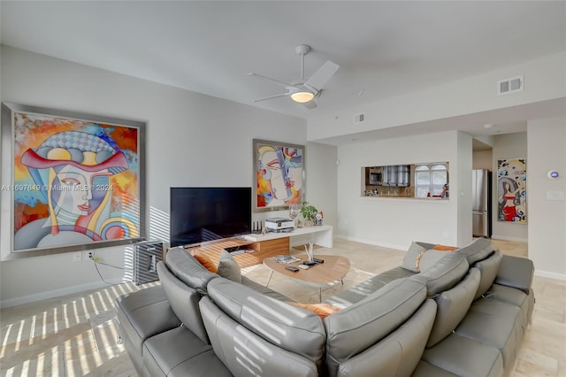 living room featuring ceiling fan