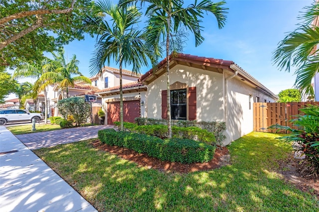 view of property exterior with a garage and a lawn