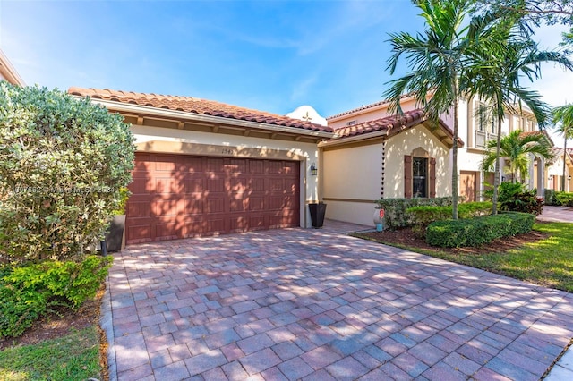 mediterranean / spanish-style home with a garage