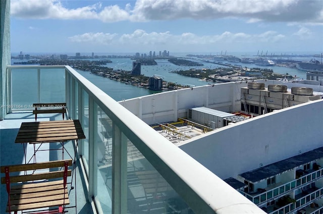 balcony featuring a water view