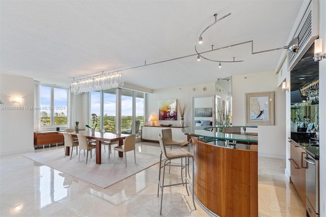 dining area with a textured ceiling