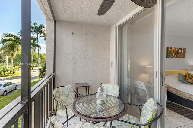 balcony featuring ceiling fan