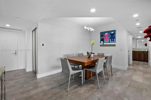 dining room with a notable chandelier