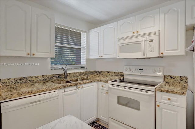 kitchen with white cabinets and white appliances