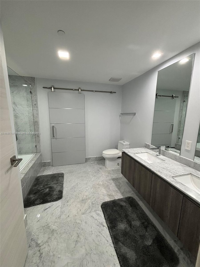 full bathroom with vanity, toilet, and shower / bath combination with glass door