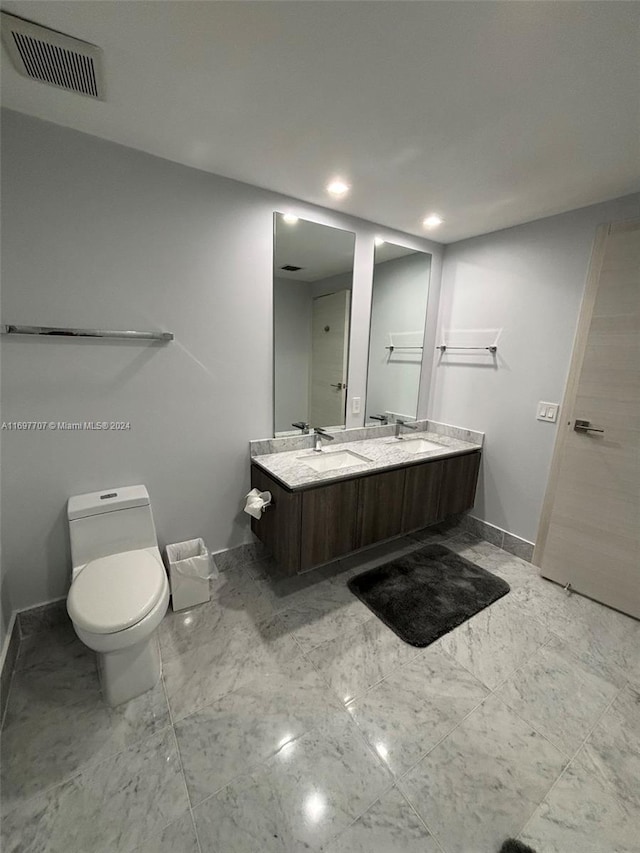 bathroom with vanity and toilet