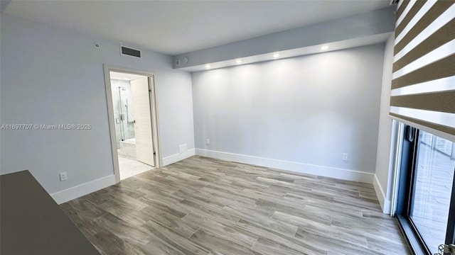 801 S Miami Ave Unit 3205/04, Miami, FL 33130 - unfurnished living room featuring wood finished floors, recessed lighting, baseboards, and visible vents