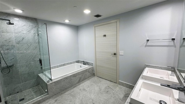 801 S Miami Ave Unit 3205/04, Miami, FL 33130 - bathroom featuring visible vents, a shower stall, baseboards, vanity, and a garden tub