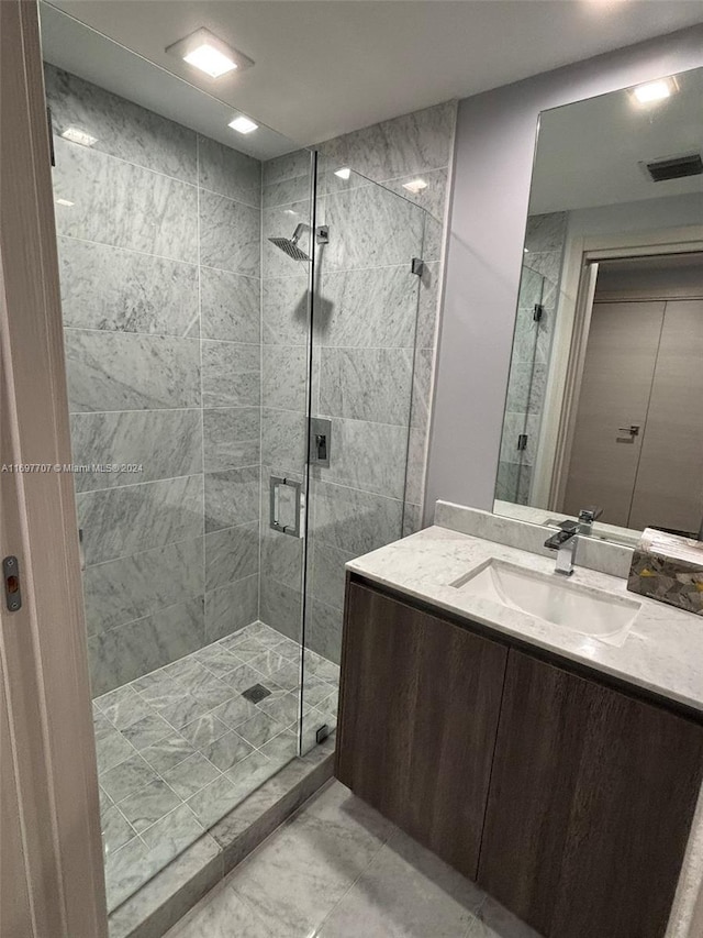 bathroom featuring vanity and walk in shower