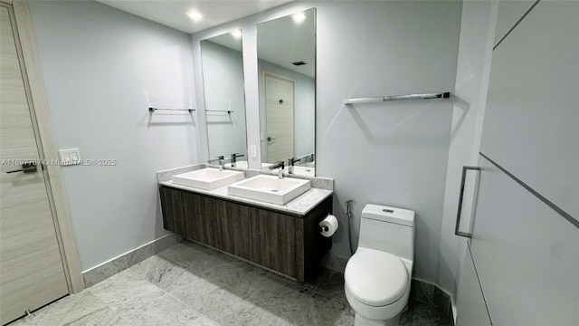 801 S Miami Ave Unit 3205/04, Miami, FL 33130 - full bath with toilet, a sink, double vanity, and baseboards