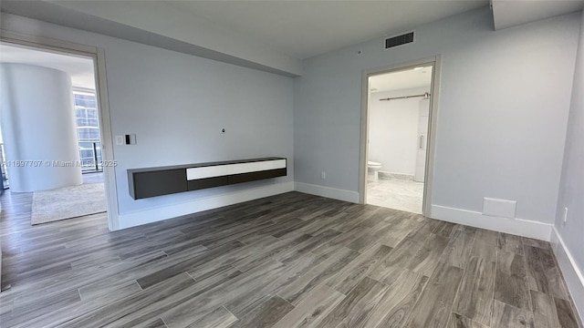 801 S Miami Ave Unit 3205/04, Miami, FL 33130 - empty room featuring visible vents, baseboards, and wood finished floors