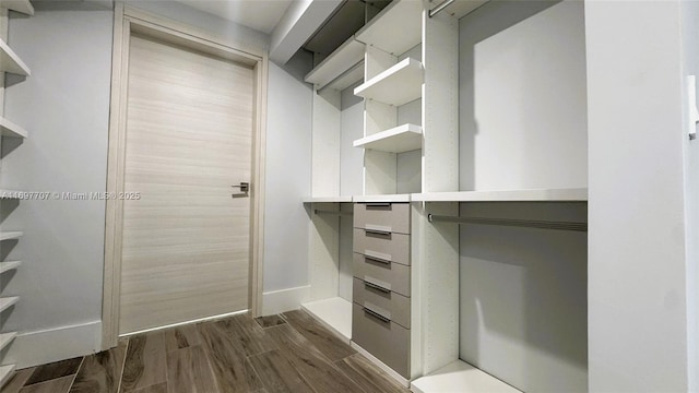 801 S Miami Ave Unit 3205/04, Miami, FL 33130 - spacious closet featuring dark wood finished floors