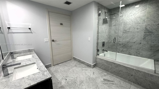 801 S Miami Ave Unit 3205/04, Miami, FL 33130 - bathroom with visible vents, tiled shower / bath combo, baseboards, double vanity, and a sink