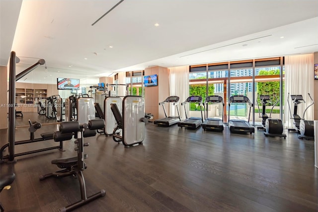 801 S Miami Ave Unit 3205/04, Miami, FL 33130 - gym with floor to ceiling windows and wood finished floors