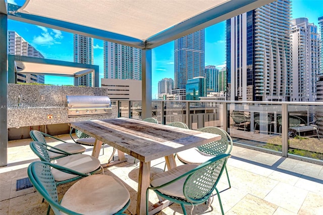 801 S Miami Ave Unit 3205/04, Miami, FL 33130 - view of patio with a city view, area for grilling, outdoor dining area, and exterior kitchen