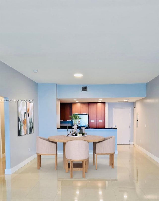 dining room with light tile patterned floors