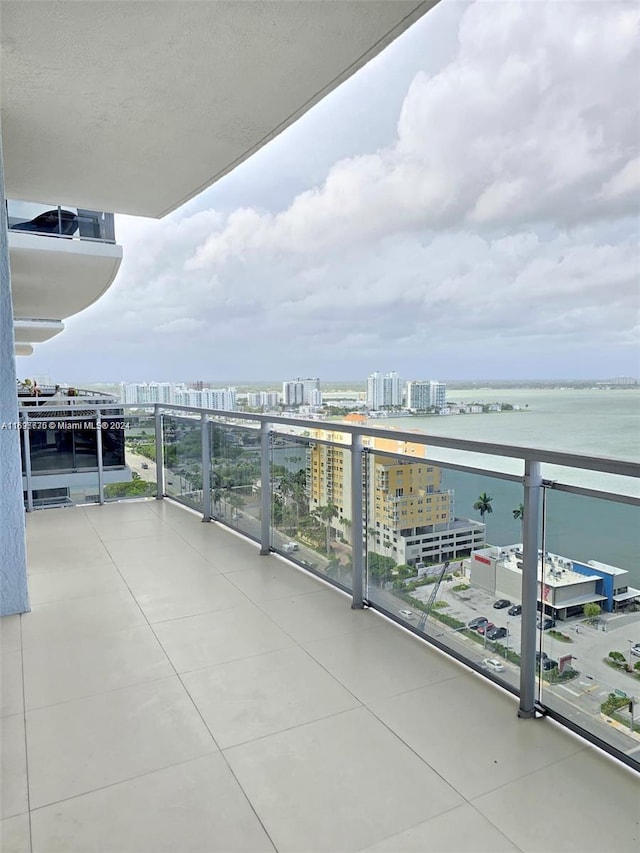 balcony featuring a water view