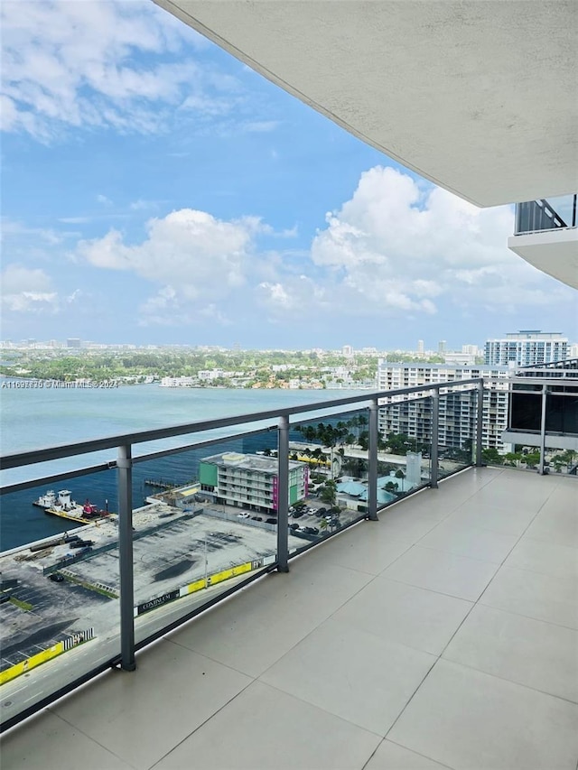 balcony featuring a water view