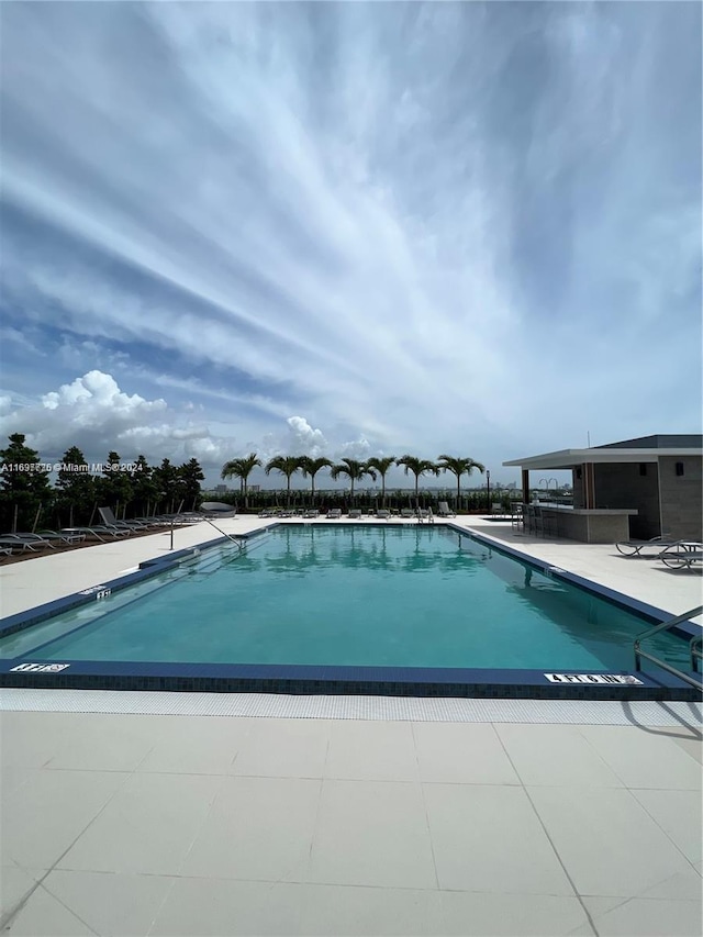 view of swimming pool with a patio area