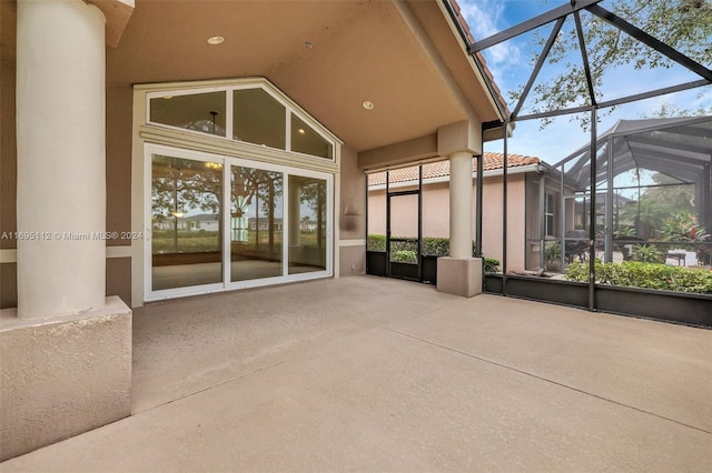 view of patio / terrace featuring glass enclosure