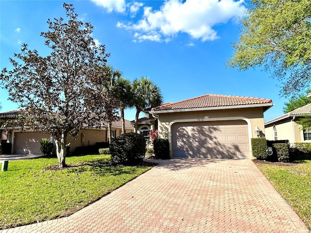 mediterranean / spanish-style house with a front yard