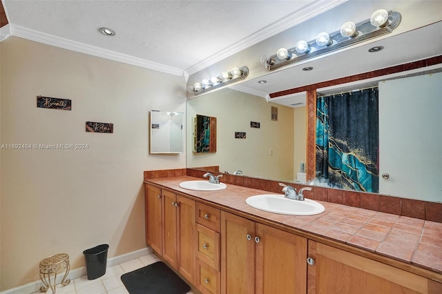 bathroom featuring tile patterned flooring, vanity, ornamental molding, and a textured ceiling