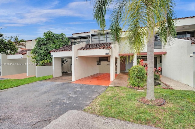 mediterranean / spanish-style home with a front yard