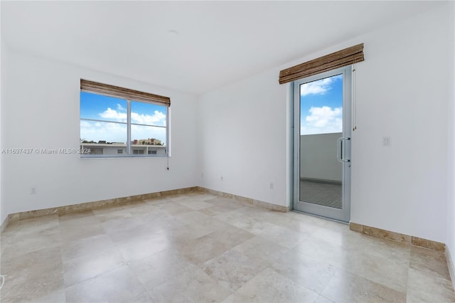 spare room with plenty of natural light