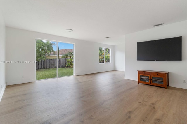 unfurnished living room featuring light hardwood / wood-style flooring