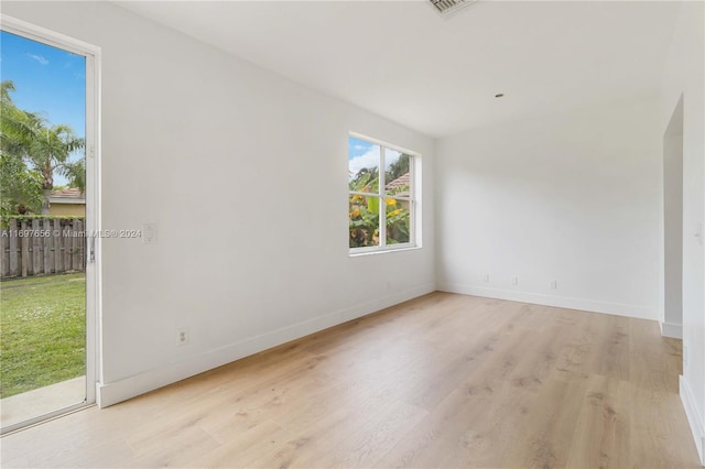 unfurnished room with light hardwood / wood-style flooring