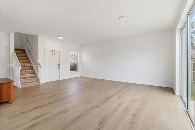 interior space with light wood-type flooring and a healthy amount of sunlight