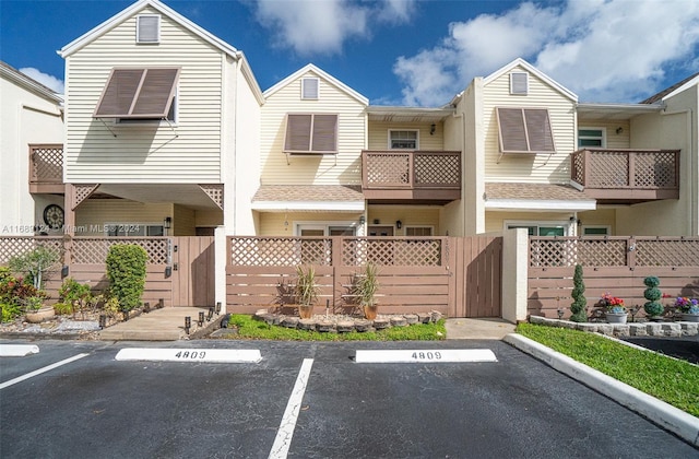 4809 S Hemingway Cir Unit 81, Margate, FL 33063 - view of front of home featuring a gate, uncovered parking, and a fenced front yard
