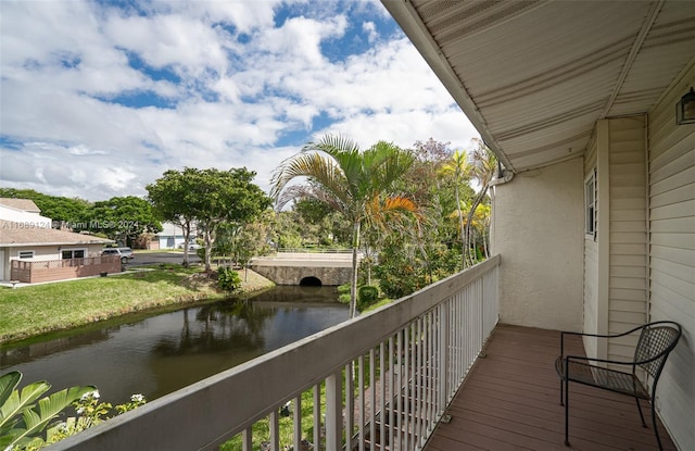 balcony featuring a water view