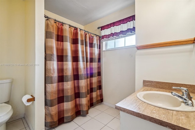 bathroom featuring tile patterned flooring, vanity, a shower with shower curtain, and toilet