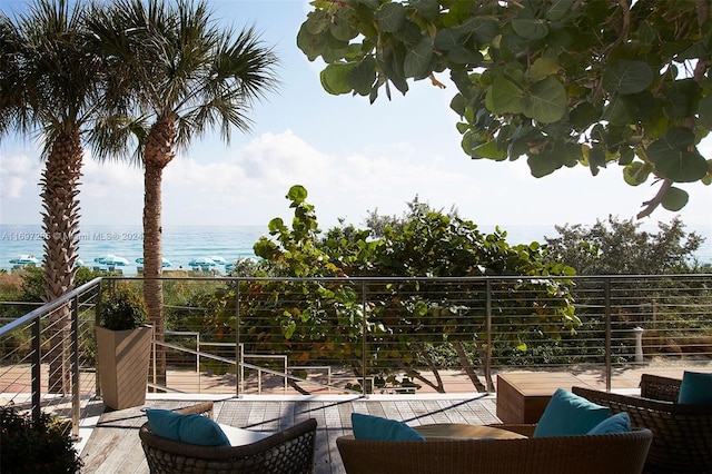 balcony with a view of the beach and a water view