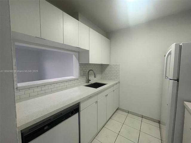 kitchen featuring backsplash, white cabinetry, sink, and white appliances