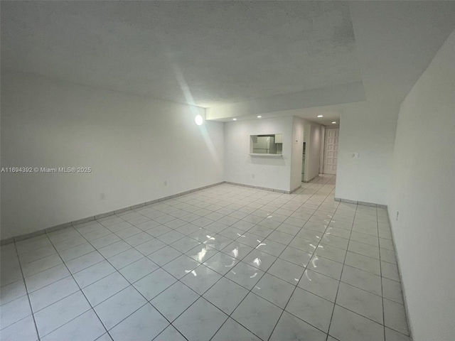 empty room featuring light tile patterned floors