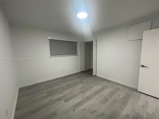 unfurnished bedroom featuring light wood-type flooring