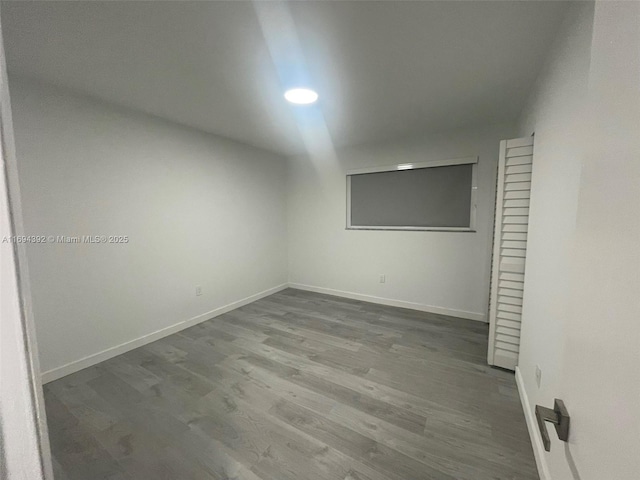 empty room featuring wood-type flooring