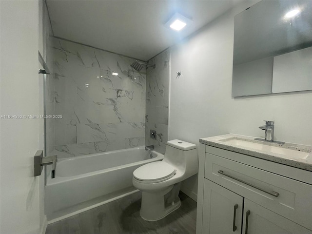 full bathroom with wood-type flooring, vanity, toilet, and tiled shower / bath