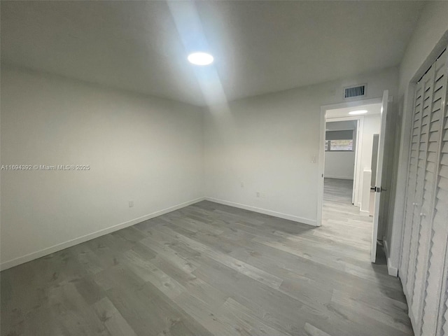 spare room featuring light hardwood / wood-style flooring