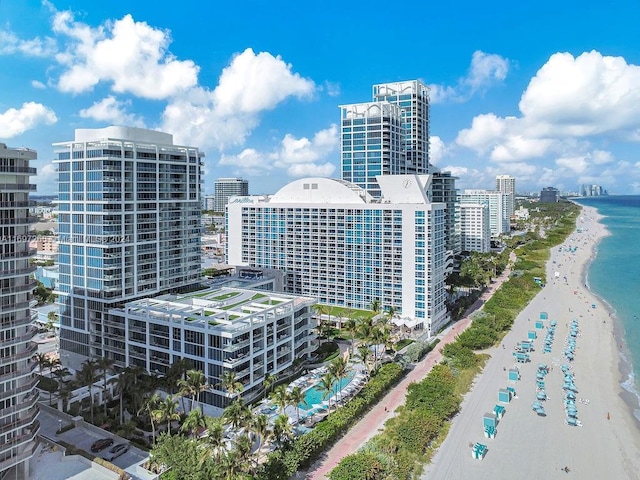 city view featuring a water view and a beach view