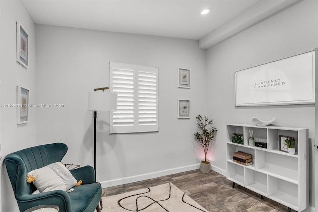 living area with lofted ceiling and dark hardwood / wood-style floors