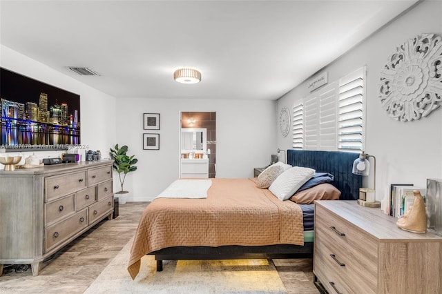 bedroom featuring connected bathroom