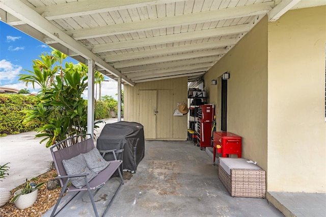 view of patio / terrace featuring a carport