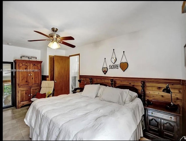 bedroom with light tile patterned floors and ceiling fan